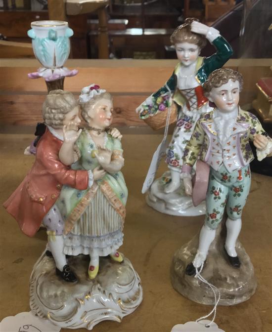 German porcelain figural candlestick and three costume figures